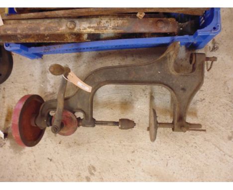 A cast iron bench pillar drill, hand driven