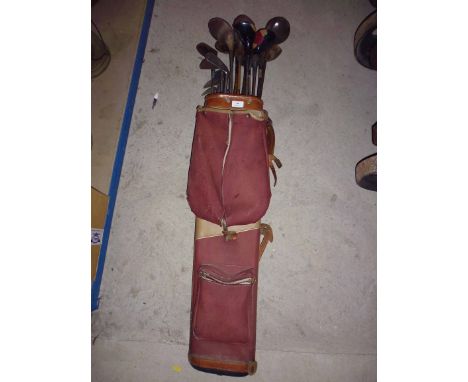 A Vintage golf club bag with range of clubs