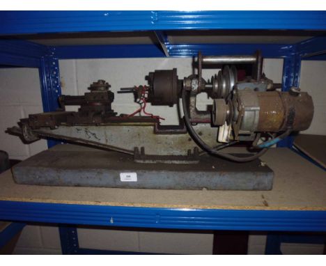 A bench mounted lathe
