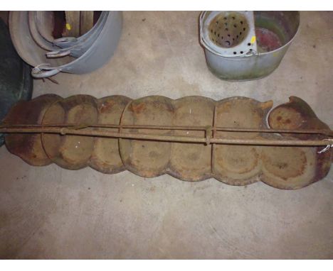 A 14 space cast iron piglet feed trough, AF
