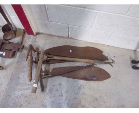 Three hay knives and two other tools