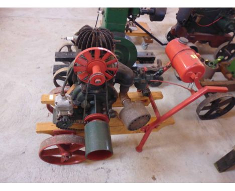 A small stationary engine on trolley, model and year unknown