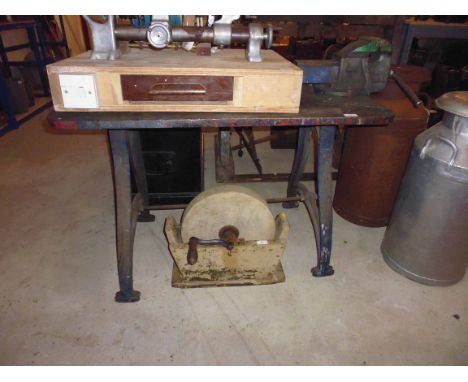 A metal workshop bench with vice