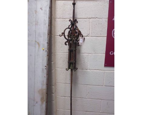 A cast iron weather vane column