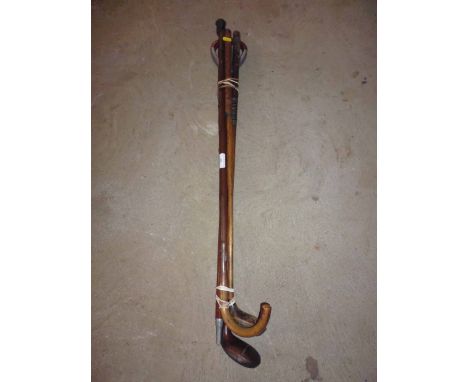 Two early golf clubs, shooting stick and walking stick