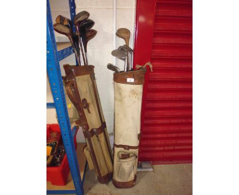 Two canvas and leather golf bags and Vintage clubs