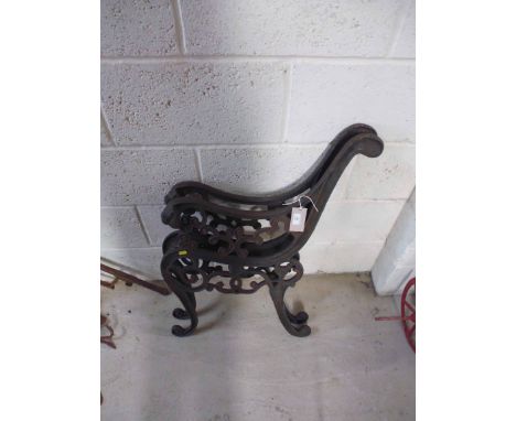 A pair of ornate bench ends