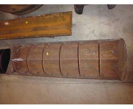 A cast iron pig trough with dividers, AF