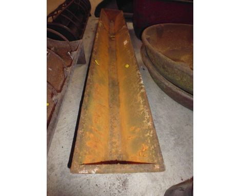 A small cast iron pig trough