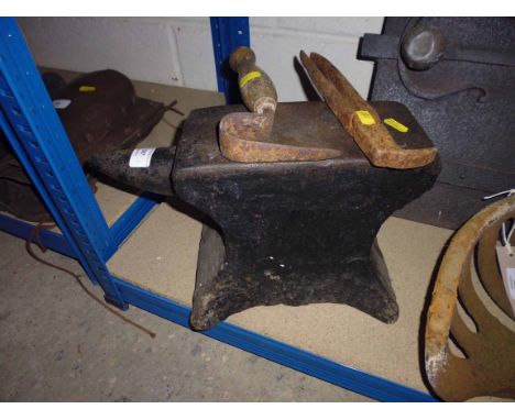 A small Blacksmith's anvil with two tools