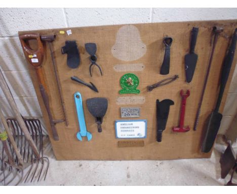 A display board of Vintage tools and signs