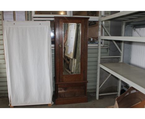 An oak mirror door single wardrobe