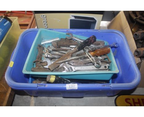 A box of various tools, including spanners