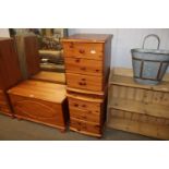 A pair of pine three drawer bedside chests
