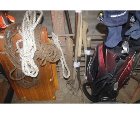 A collection of gardening tools and sledge hammer