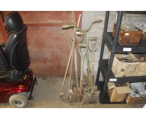 A quantity of vintage long handled garden tools; to include shovels and forks 