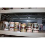 A collection of various Budweiser Beer steins