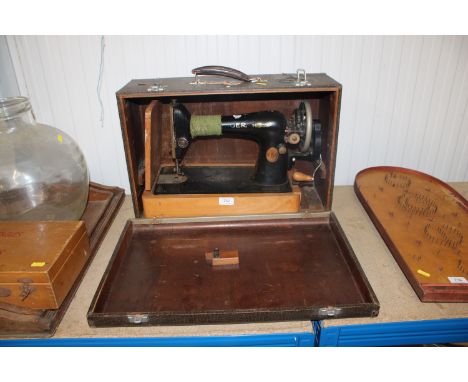 A Singer sewing machine in fitted case