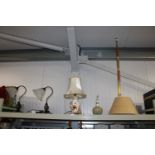 A collection of various table lamps and shades tog