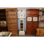 A white painted storage unit in the form of a Gran