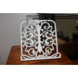 A wrought iron book stand