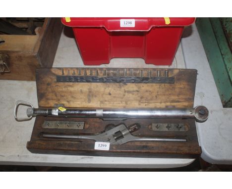 A torque wrench and a tap and die set