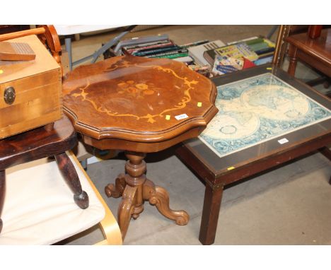 A reproduction occasional table raised on tripod base