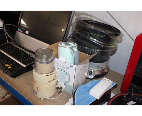 An electric kettle, a blender and a steamer