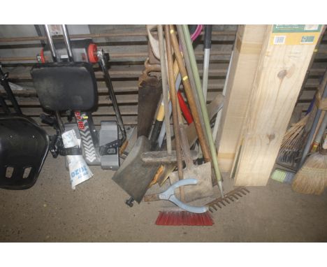 A collection of long handled and other gardening tools