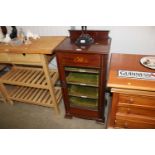 An Edwardian mahogany and inlaid music cabinet