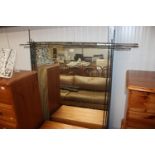 A large decorative framed wall mirror