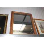 A stripped pine framed wall mirror