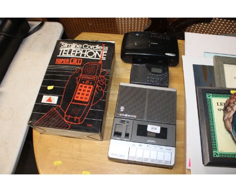 A Grundig cassette recorder, a slimline cordless telephone, a Grundig radio and a Polaroid radio