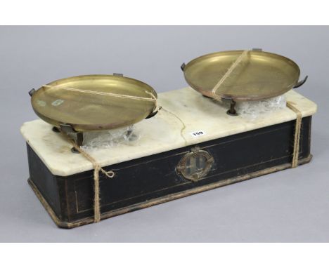 A vintage French patisserie scale, fitted two brass pans &amp; fitted with white marble slab to the ebonised wooden base, bea