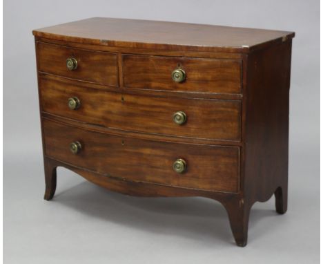 An early 19th century figured mahogany bow-front chest, fitted two short &amp; three long drawers with turned knob handles, o