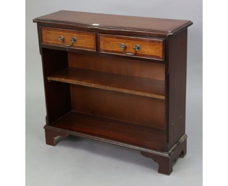 A reproduction inlaid-mahogany small standing bookcase fitted two frieze drawers above an open shelf, &amp; on bracket feet, 