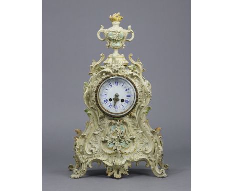 A 19th century French mantel clock with blue painted roman numerals to the white enamel dial, with striking movement &amp; in