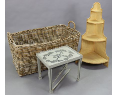 A large wicker log basket, 39” long; together with a painted wooden rectangular coffee table; &amp; a small four-tier corner 