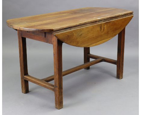 A French cherry or fruitwood oval drop-leaf kitchen table fitted with an end drawer, &amp; on square chamfered legs with plai