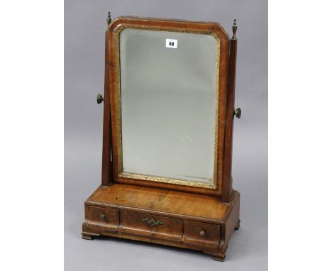 An 18th century walnut rectangular swing toilet mirror inset gilt inner slip, &amp; fitted with three small drawers to the bo