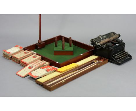 A vintage “Royal” typewriter; together with a “Diplomat” two-piece snooker cue; a table skittles game; &amp; approximately fo