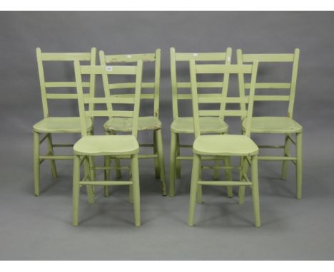 A set of six pale green painted rail-back occasional chairs with hard seats, &amp; on round tapered legs with spindle stretch