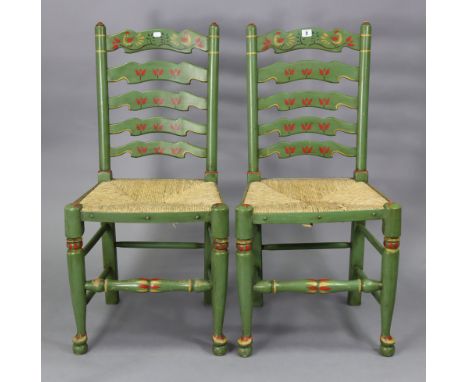 A matching pair of ladder-back dining chairs with woven rush seats, &amp; on turned tapered legs with turned front stretchers