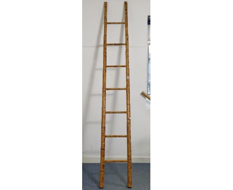 A vintage bamboo seven-rung ladder, 8’ high.