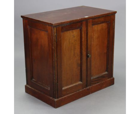 A 19th century mahogany dwarf cabinet fitted with a centre shelf enclosed by a pair of panel doors, &amp; on a plinth base, 3