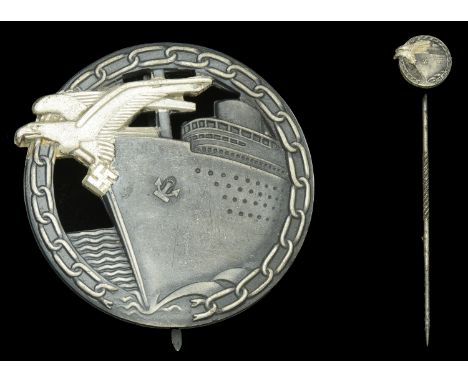 A Kriegsmarine Blockade Breaker’s Badge in its Original Small Type Presentation Case with Miniature. Large Badge in factory n