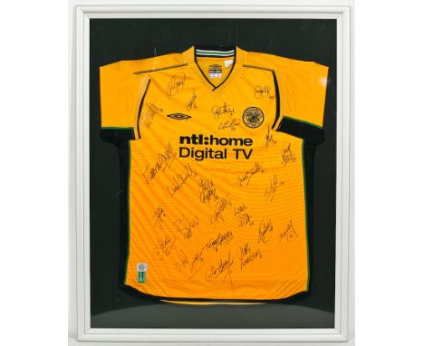 CELTIC FOOTBALL CLUB SHIRT
in yellow and signed by team members including Balde and the manager Martyn O'Neil, framed