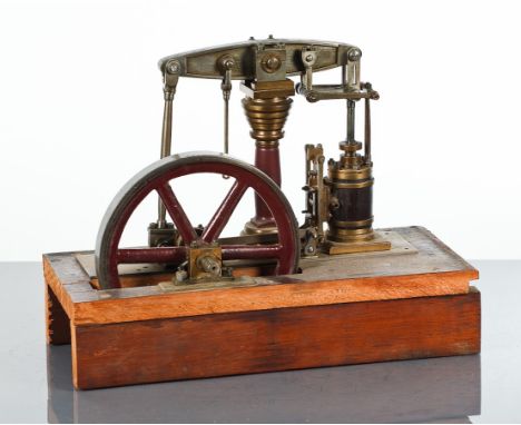 LIVE STEAM 7-INCH BEAM ENGINE
unpainted, with single piston, on an oak plinth, 29cm high