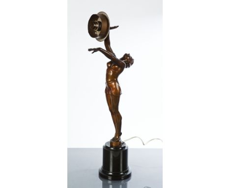 ART DECO SPELTER FIGURE LAMP
in the form of a gymnast holding the lamp aloft, on dark slate plinth base, 57cm high