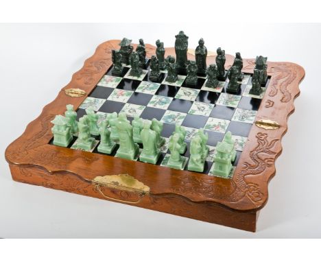 CHINESE c. 1950s/60s CHESS SET
the board with bone and hardstone squares and with dark green and light green figures, complet